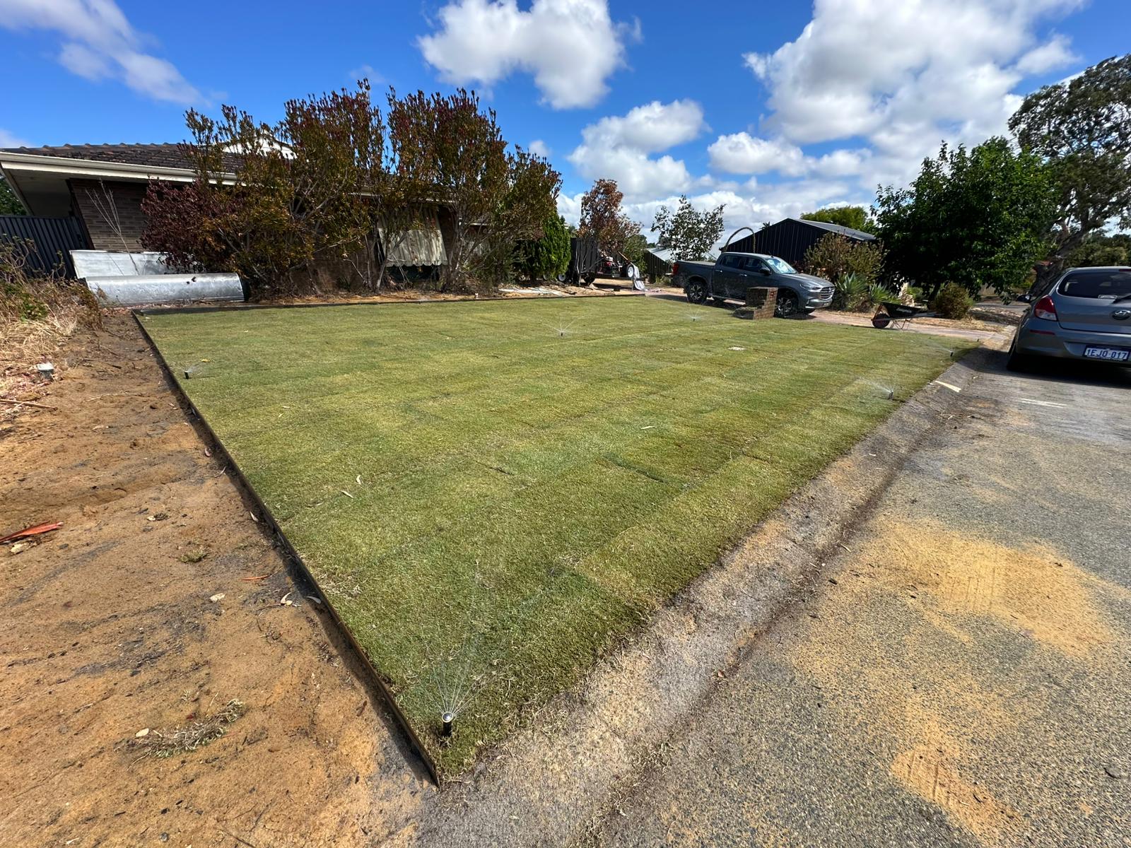 New turf install, brick-edged lawn